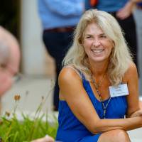 Guests sitting outside talking.